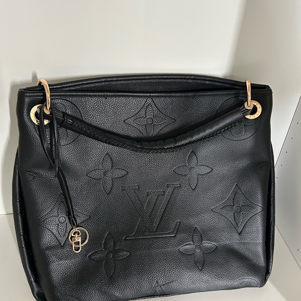 NOT a real Louis viuitton , but it’s a beautiful purse,pre-owned
